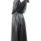 Gold statement dress side angle showing asymmetric hemline and draping