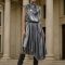 Model wearing the DaRousso Liquid Silver Metallic Dress in front of classical architectural columns.